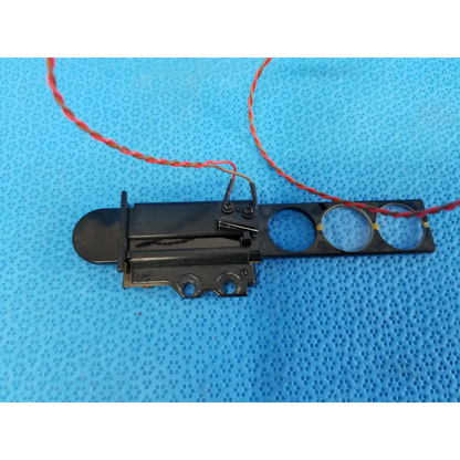 Black plastic and metal internal diopter slider lens assembly with three cutouts and red wire harness for topcon retinal camera