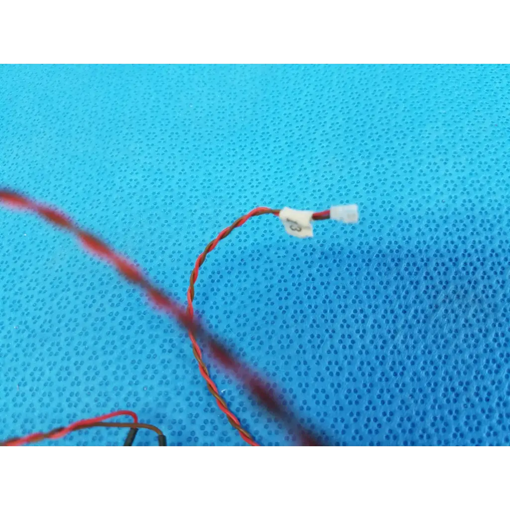 Red and black twisted wire with white plastic connector for diopter slider lens mounting bracket in topcon trc-nw8 retinal camera