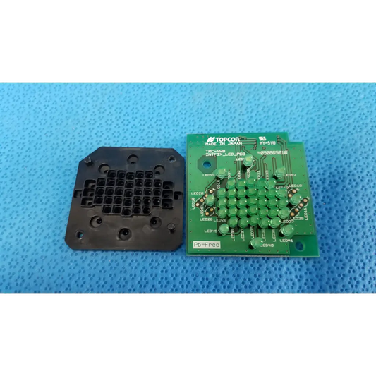 Green led target panel with black plastic housing labeled topcon marked pb-free for external fixation led use