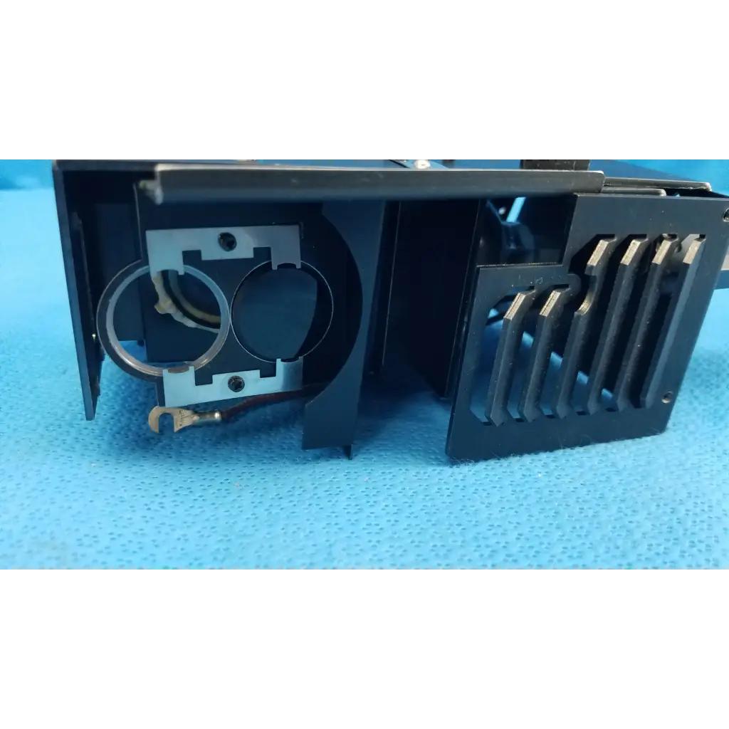 Black plastic halogen illumination lamp housing with metal components and ventilation slats for topcon fundus camera