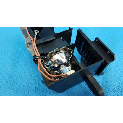 Black halogen illumination lamp housing with shiny silver bulb and orange wiring for topcon trc-nw8 fundus camera