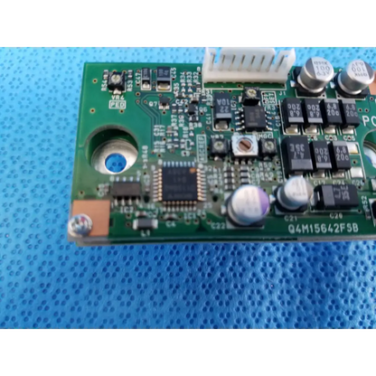 Green printed circuit board with capacitors resistors and a central microchip internal image sensor for topcon retinal camera