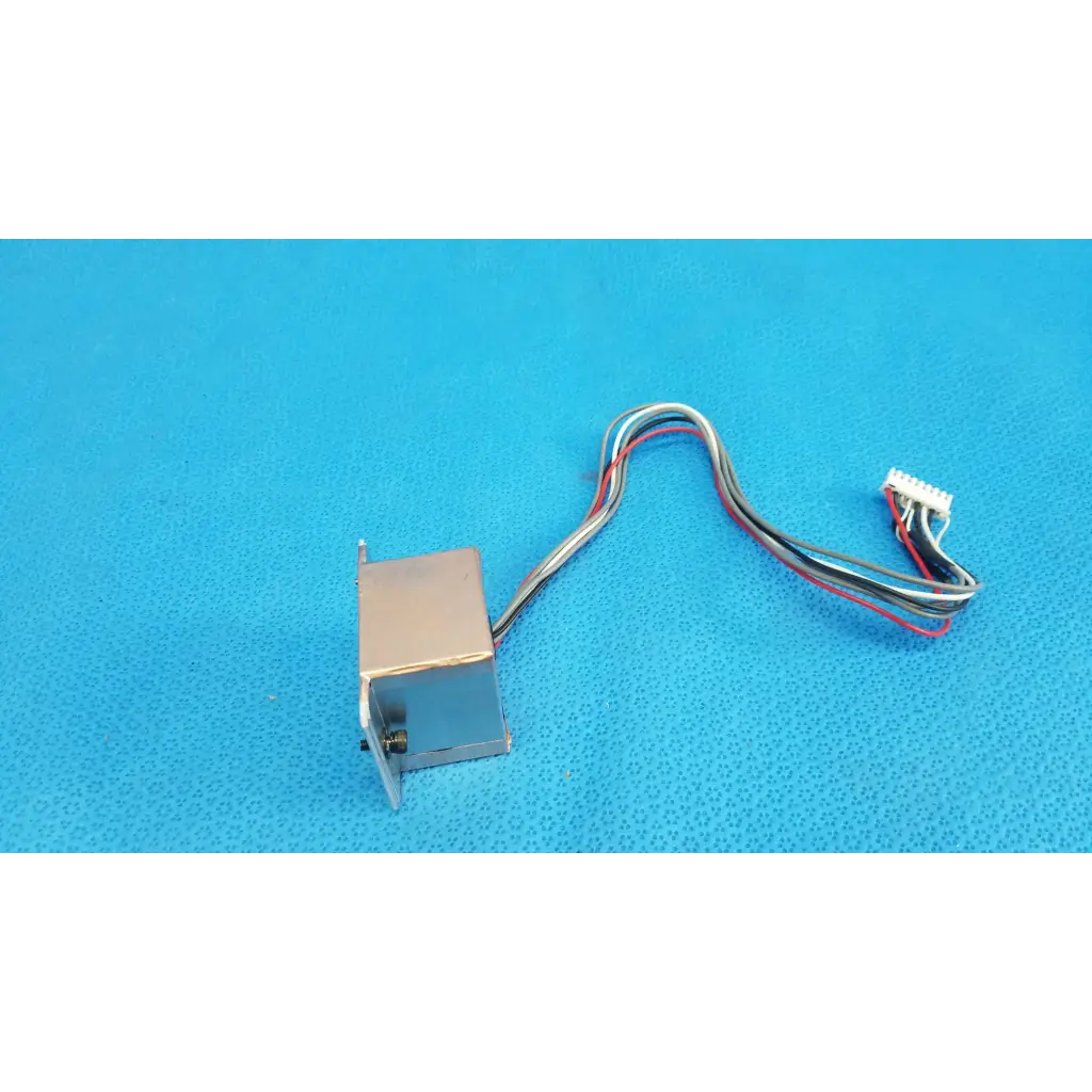 Silver metallic rectangular ccd sensor module with multi-colored wiring and white connector for imaging alignment in topcon retinal camera