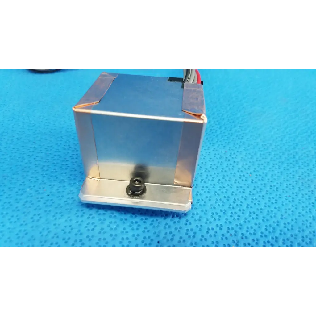 Silver metallic rectangular ccd sensor module with wiring and black screw base for internal imaging alignment in topcon camera