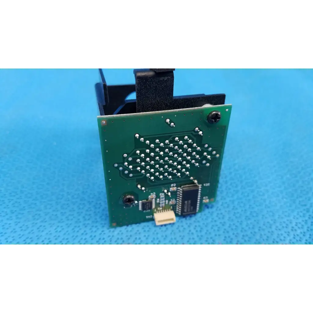 Green rectangular lcd dot matrix circuit board with silver solder points and black chips for fixation target use