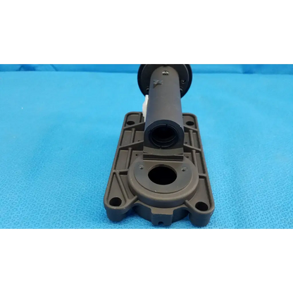 Dark gray plastic shock absorber with cylindrical body and bracket for internal main optical lens barrel focus drive block assembly