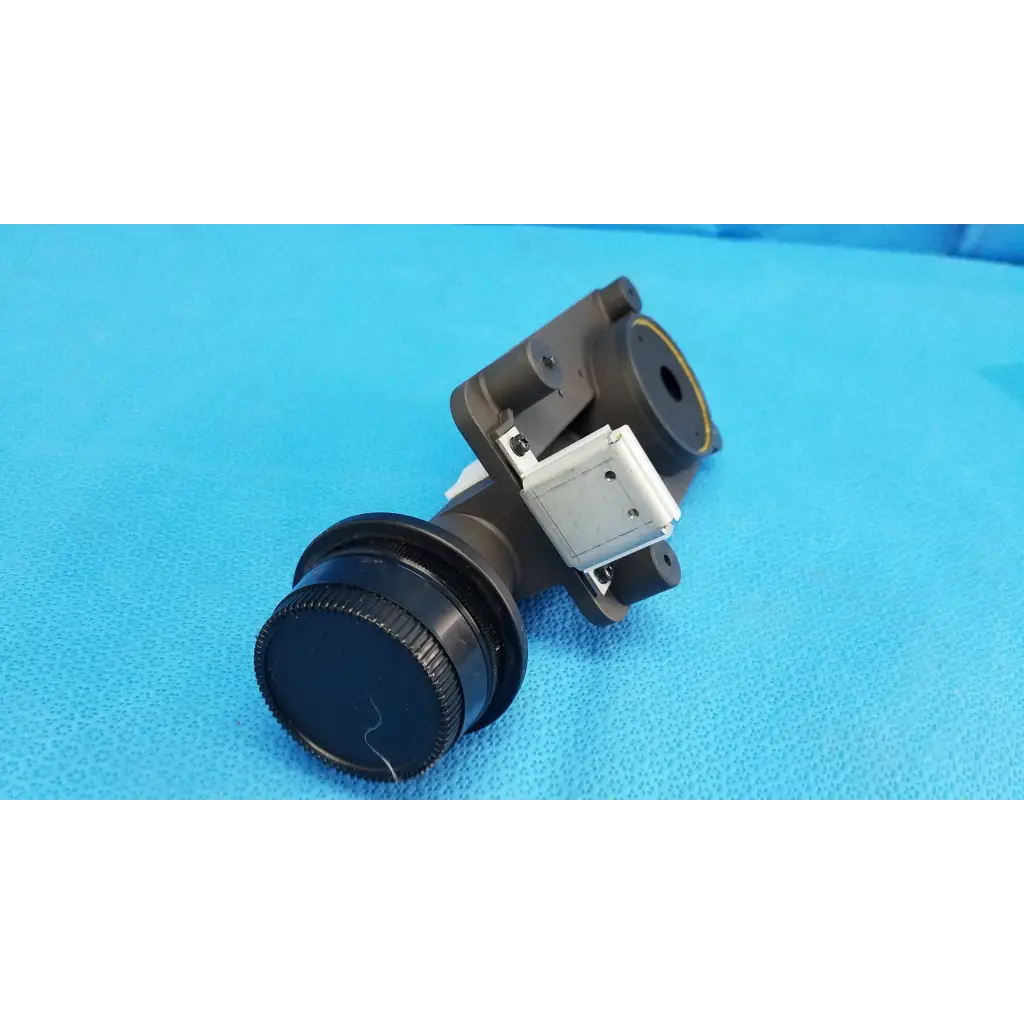 Black lens barrel with textured focus drive and porro prism mounted on adapter ring for topcon trc-nw8 camera