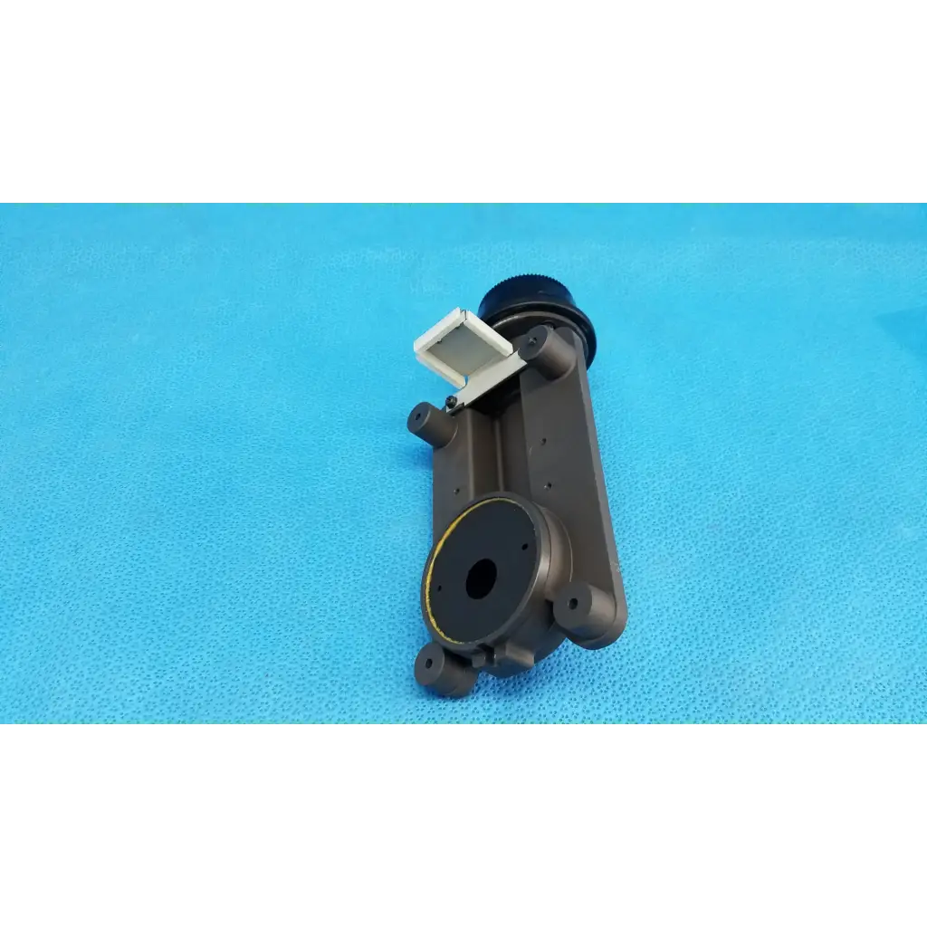 Dark gray plastic internal main optical lens barrel focus drive block with white latch and porro prism for topcon camera