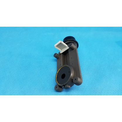 Dark gray plastic internal main optical lens barrel focus drive block with white latch and porro prism for topcon camera