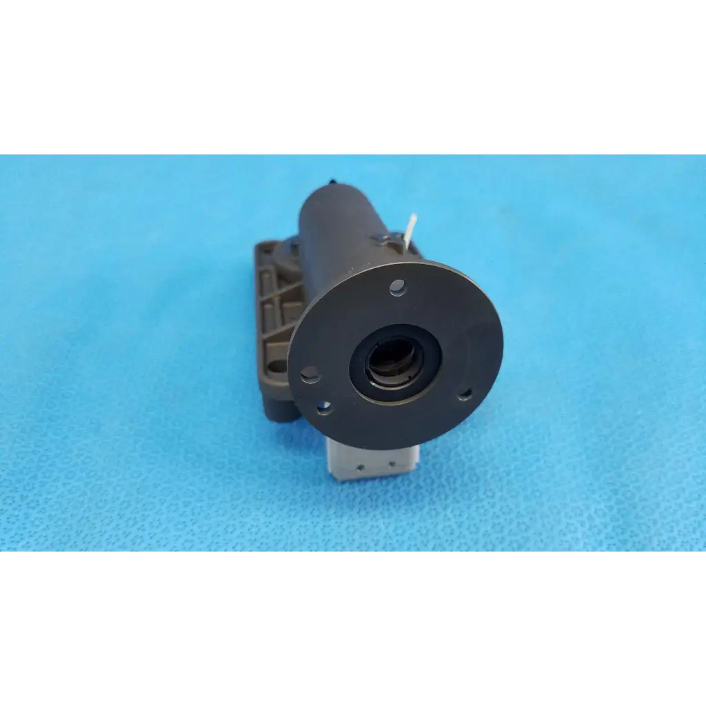 Black cylindrical internal lens barrel focus drive block assembly with porro prism and mounting holes for topcon trc-nw8