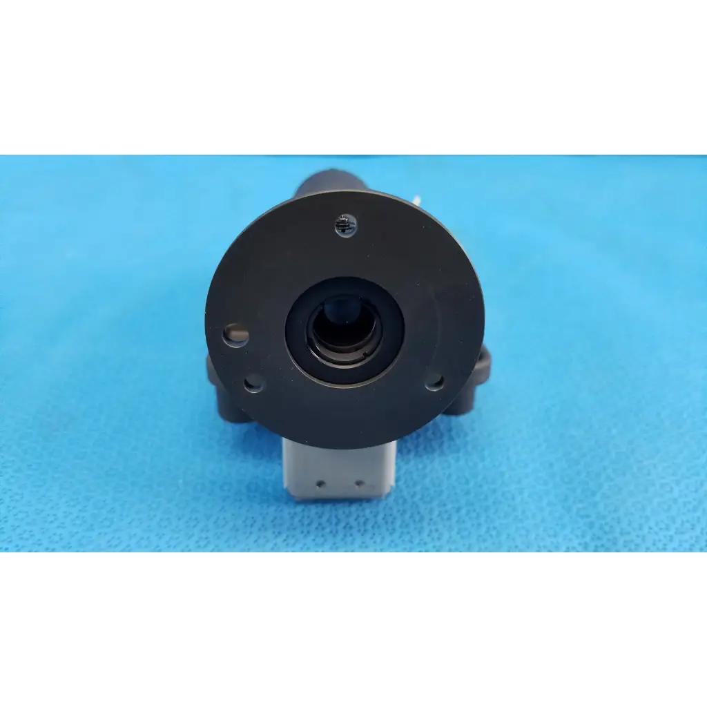 Black circular lens barrel focus drive block with porro prism mounted on gray base for topcon trc-nw8 camera