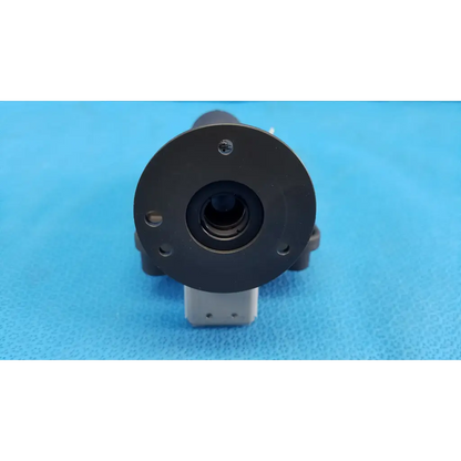 Black circular lens barrel focus drive block with porro prism mounted on gray base for topcon trc-nw8 camera