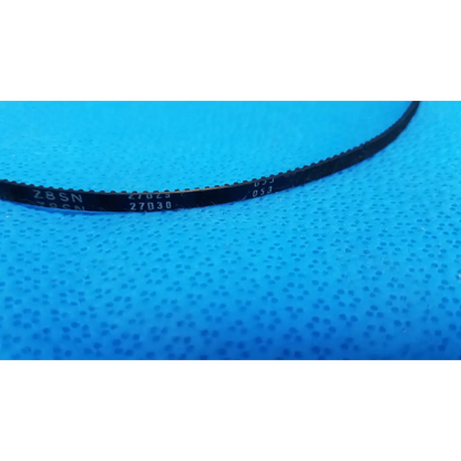 Black rubber mechanical drive timing belt with serrated edges and white markings for topcon fundus camera