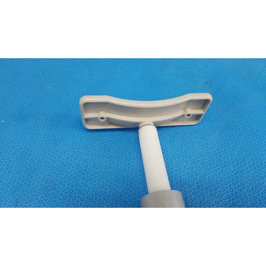 Gray plastic t-shaped handle with curved top plate and cylindrical shaft for motorized chinrest gear motor assembly