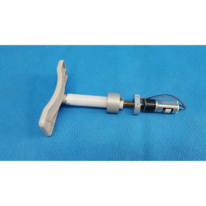 White plastic t-shaped handle attached to a cylindrical shaft with micro gear motor for motorized chinrest assembly