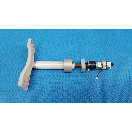 White plastic handle attached to micro gear motor assembly with metallic components for motorized chinrest use