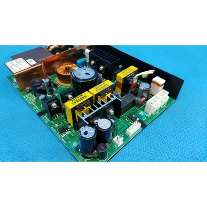 Green printed circuit power supply board with blue capacitors yellow heat sinks and black connectors for topcon fundus camera