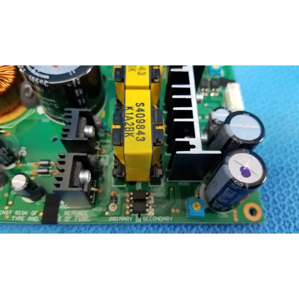 Green power supply board with black and yellow capacitors and transformer for topcon fundus camera model trc-nw8