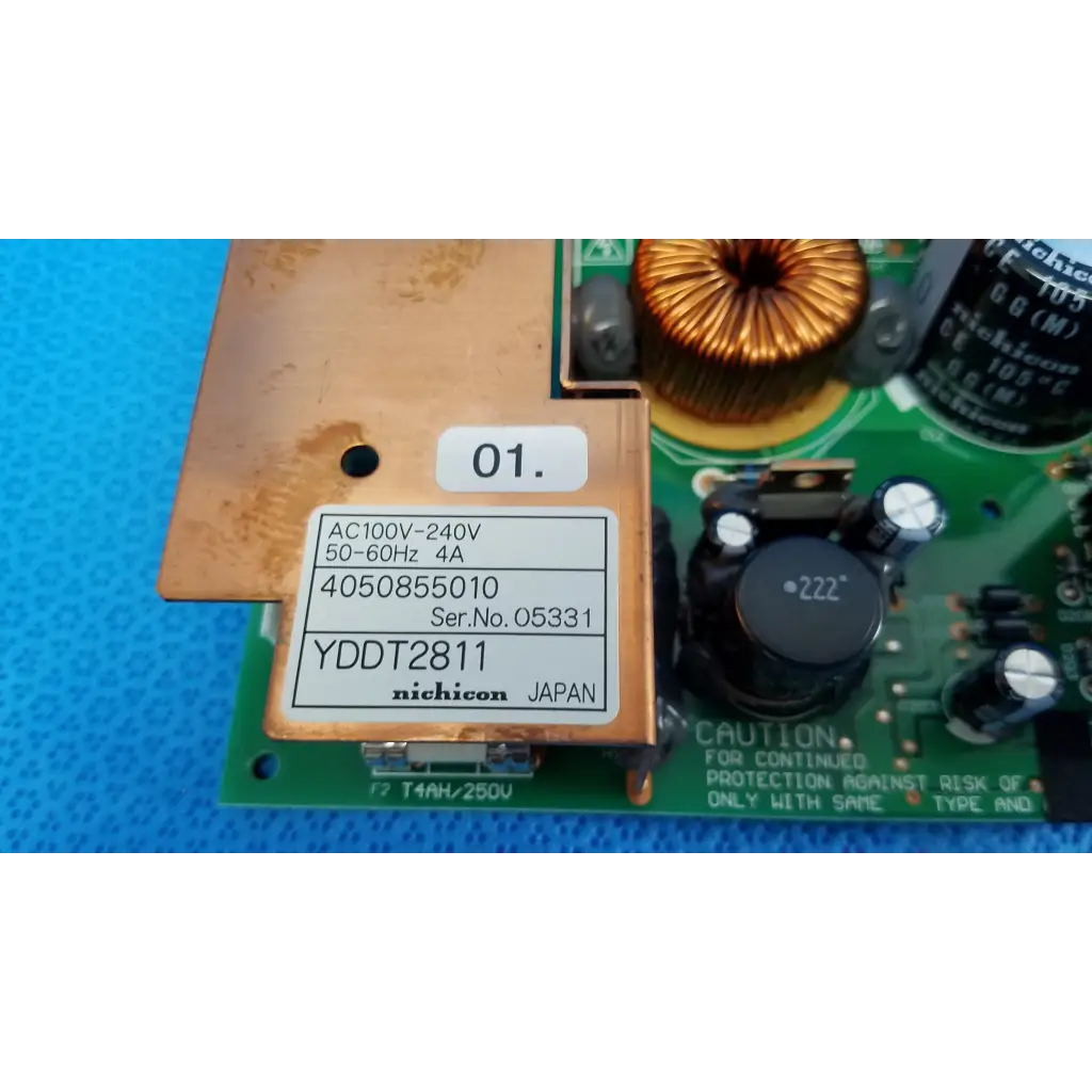 Bronze-colored nichicon yddt2811 power supply board with printed specs on green circuit board for topcon trc-nw8 fundus camera