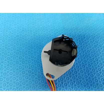 White plastic housing with black internal stepper motor components and multicolored wires for trc-nw8 retinal camera
