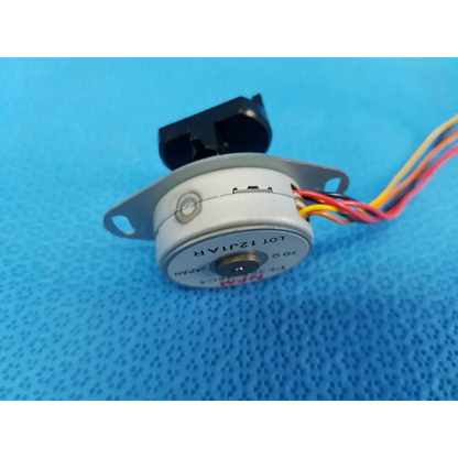 Gray cylindrical stepper motor with black plastic housing and multi-colored wiring for trc-nw8 retinal camera