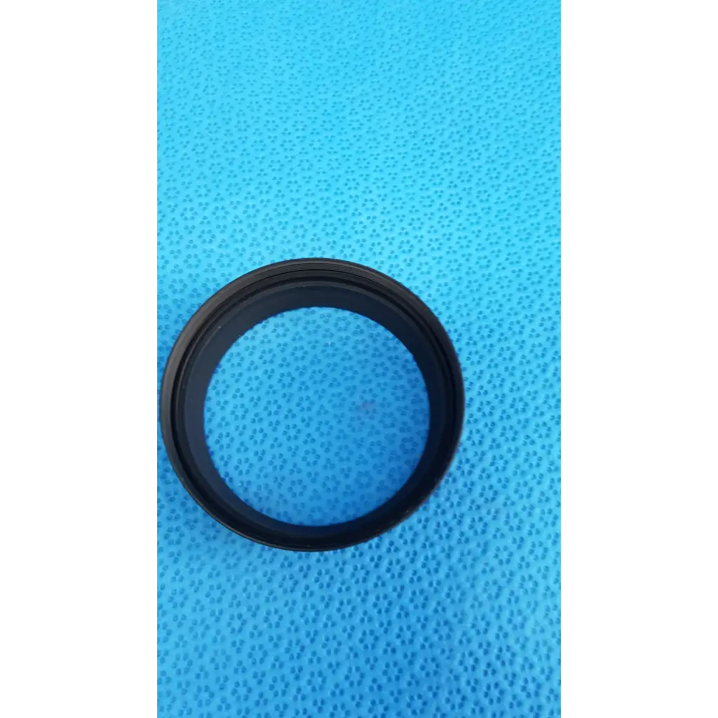 Black circular alignment ring made of rubber dust cap for viewfinder bellows in Topcon TRC-NW8 retinal camera set