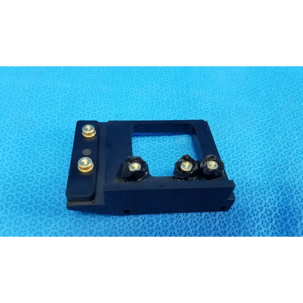 Black rectangular optical alignment mirror mount slider bracket with gold screws and black knobs for Topcon TRC-NW8 camera