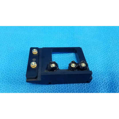 Black rectangular optical alignment mirror mount slider bracket with gold screws and black knobs for Topcon TRC-NW8 camera
