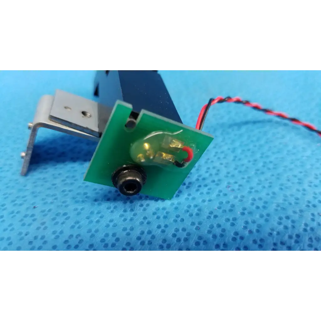 Green circuit board with black connector and red-black wire mounted on metal bracket for topcon optical alignment prism lens module
