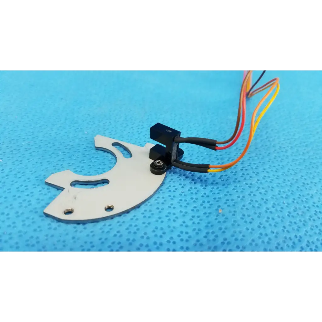 White metal gear-shaped internal optical base axis limit sensor with black electronic module and aluminum bracket assembly