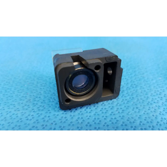 Black rectangular internal optical beam splitter lens block with circular lens and metallic accents for Topcon fundus camera