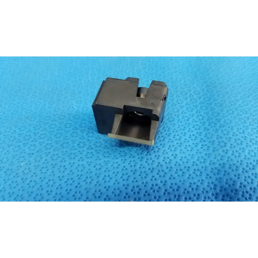 Black metal lens block trigger guard with rectangular shape and slot for trigger in topcon half mirror optical beam splitter