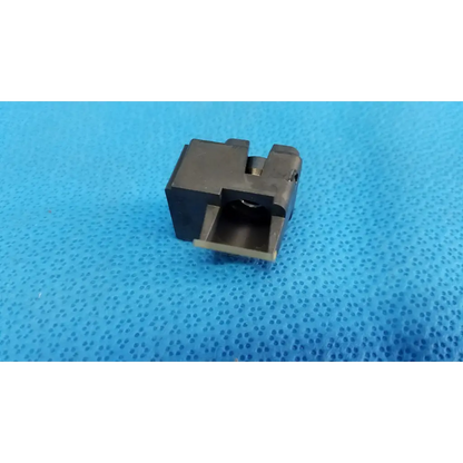 Black metal lens block trigger guard with rectangular shape and slot for trigger in topcon half mirror optical beam splitter