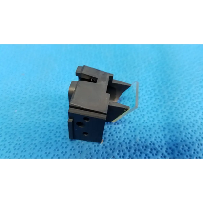 Black plastic internal optical beam splitter half mirror lens block with angular design and circular cutouts for topcon fundus camera