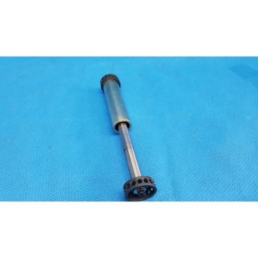 Silver metallic core piston cylinder shock absorber with black rubber end caps and threaded rod for optical core focus