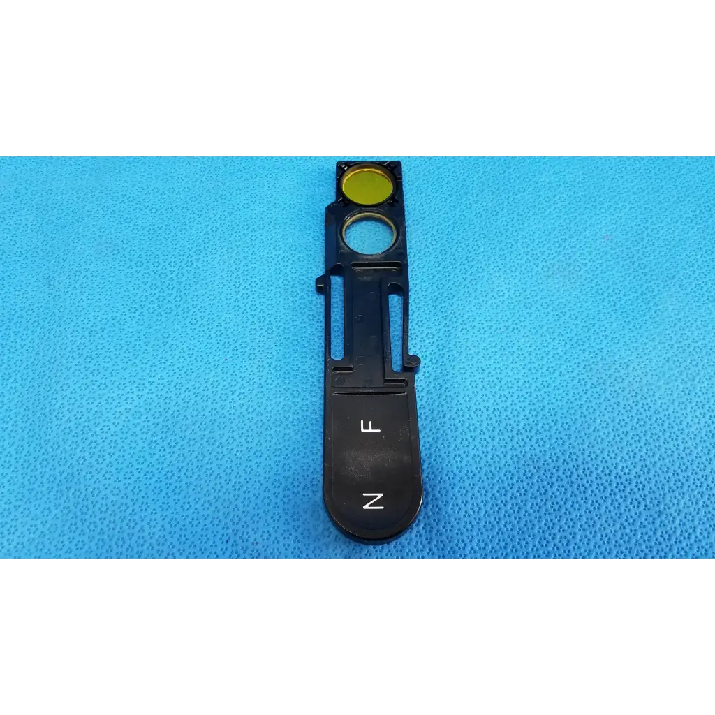 Black plastic optical filter slider with yellow filter and labeled slots l and z for topcon trc-nw8 fundus retinal camera