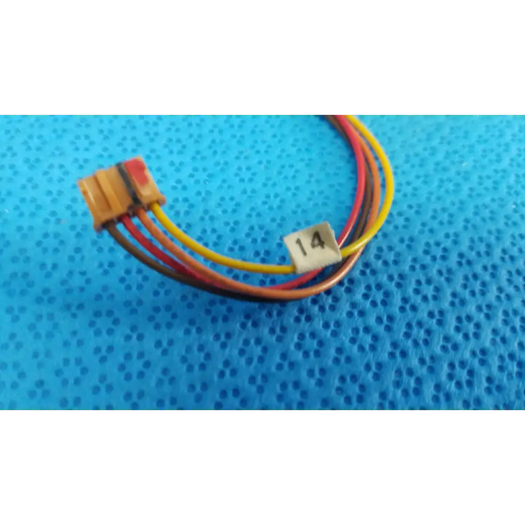A multi-colored wire harness with a yellow connector and label 14 is coiled on blue for photo interrupter use in topcon trc-nw6s