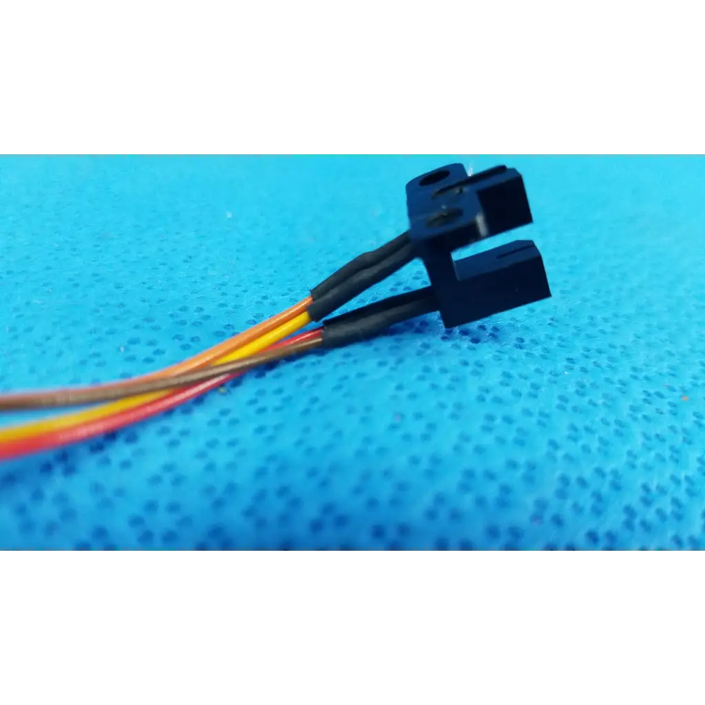 Black plastic dual connector with color-coded wires for internal optical slot photo interrupter sensor cable assembly