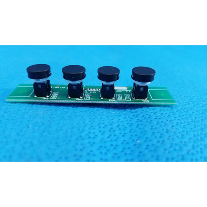 Green PCB board with four black push-button menu switch buttons for OSD control menu on Topcon TRC-NW8 camera