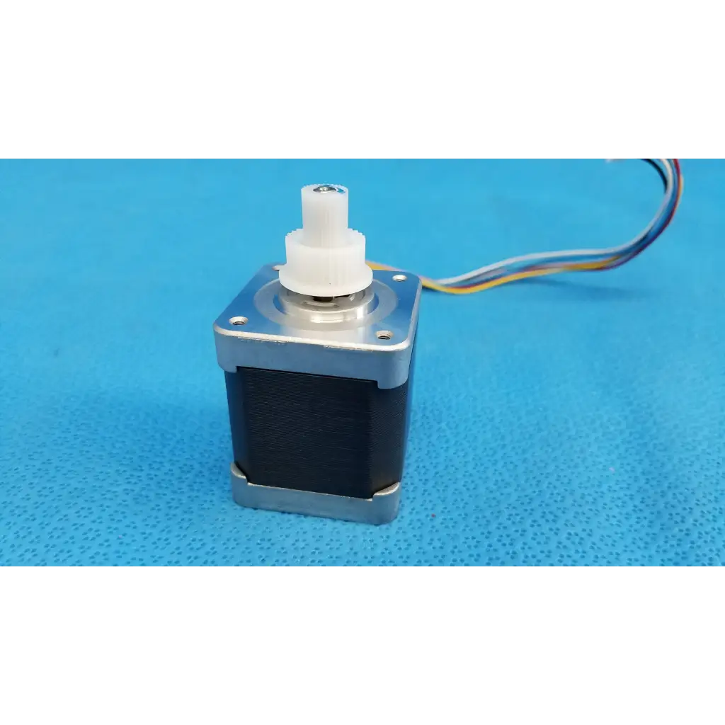 Silver and black stepper motor with white plastic gear and multi-colored wiring for topcon trc-nw8 fundus camera use