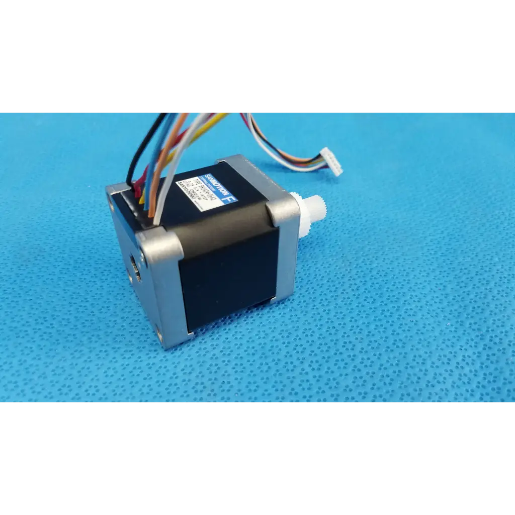 Black and silver internal Sanyo Denki stepper motor with multi-colored wiring for Topcon TRC-NW8 fundus camera