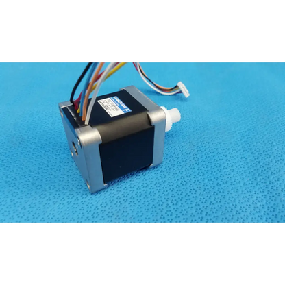 Black and silver internal Sanyo Denki stepper motor with multi-colored wiring for Topcon TRC-NW8 fundus camera