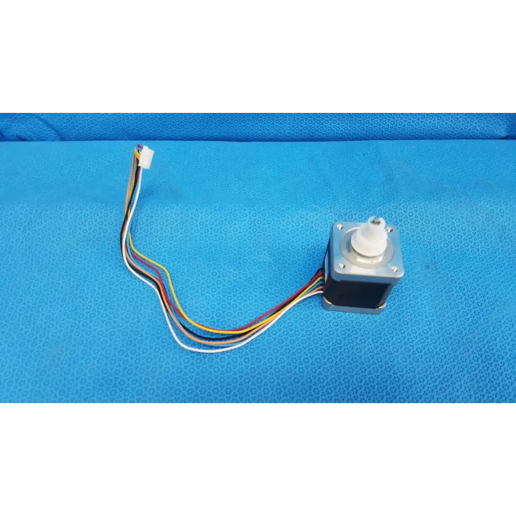 Silver internal sanyo denki stepper motor with white plastic shaft and multi-colored wiring for topcon trc-nw8 fundus camera