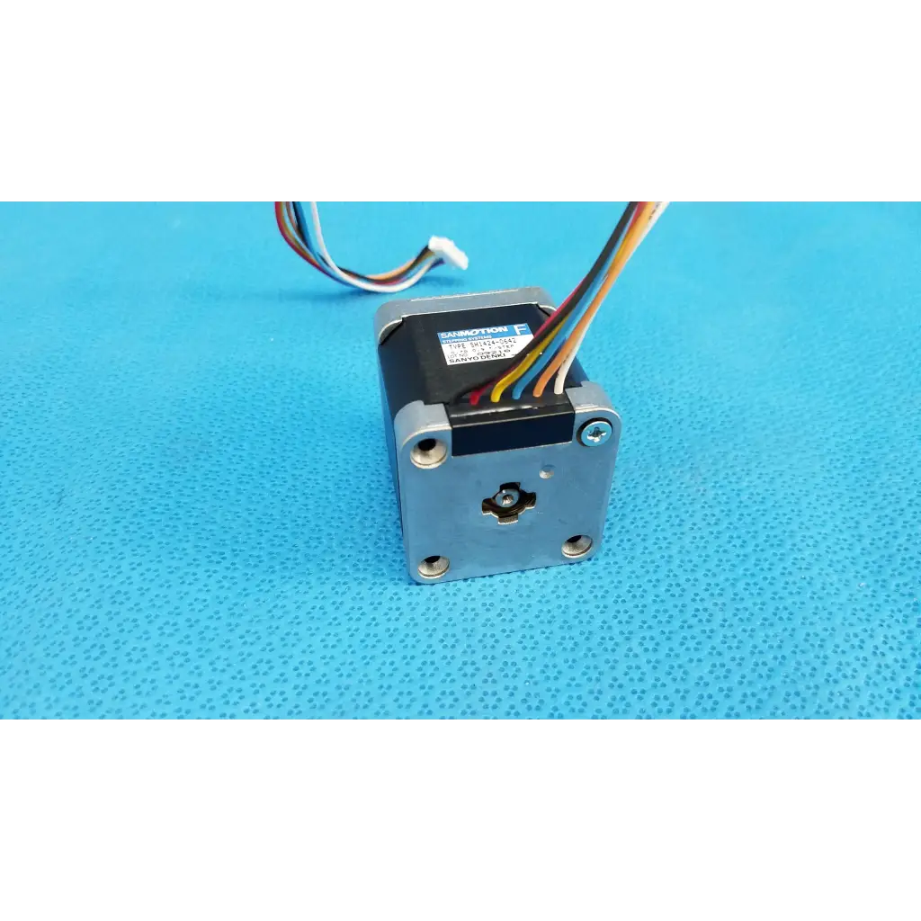 Silver-colored metal stepper motor with black top housing and multicolor wiring for topcon trc-nw8 fundus camera