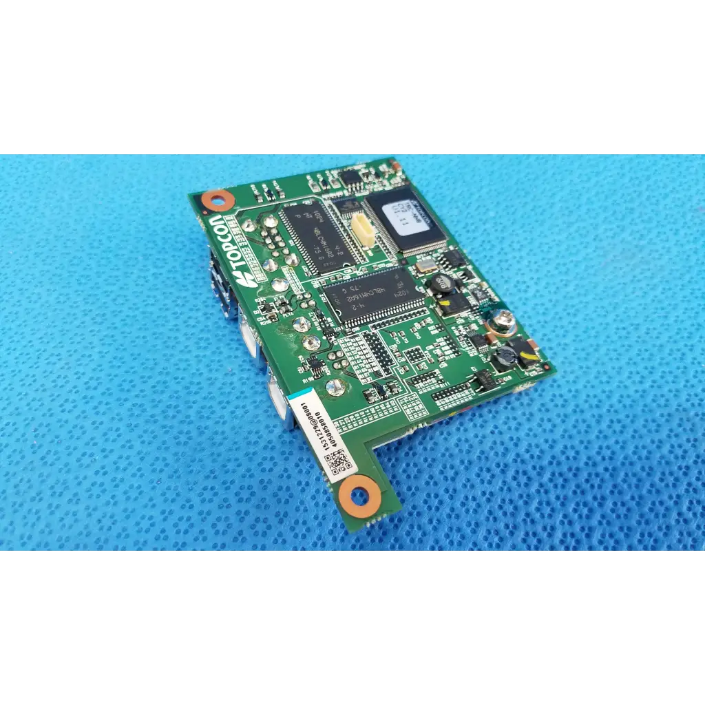 Green topcon internal sub cpu logic motherboard board with black integrated circuits and orange mounting holes for fundus retinal camera