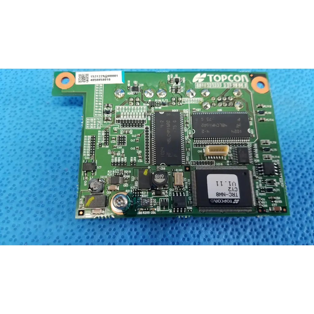 Green topcon trc-n8 logic motherboard board with black integrated circuits and silver solder points for fundus retinal camera