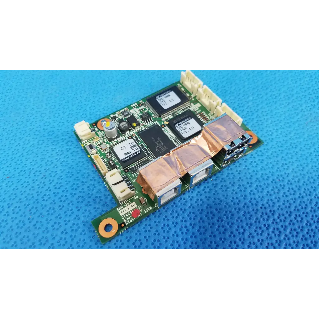 Green logic motherboard board with black integrated circuits and copper heat sinks for fundus retinal camera use