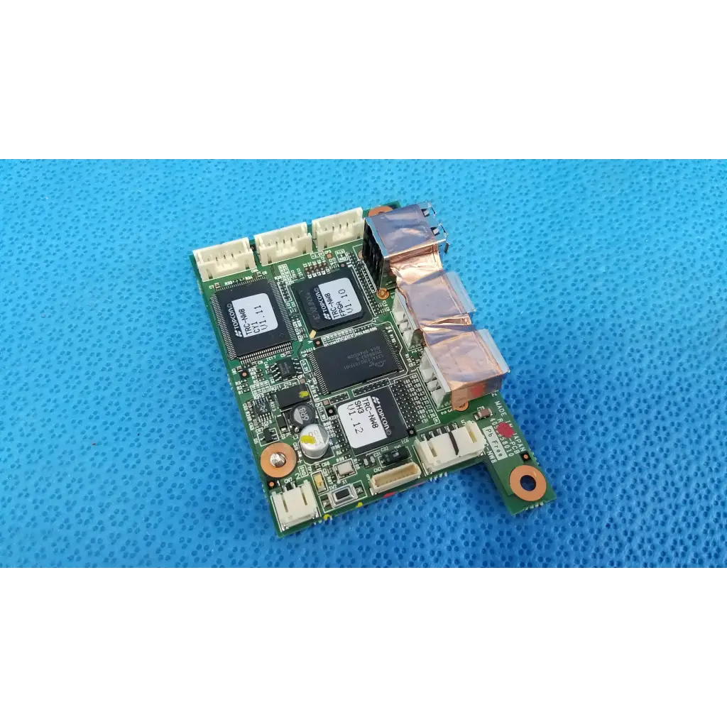 Green circuit board with black integrated circuits and silver connectors for internal sub-cpu logic motherboard board in fundus retinal camera