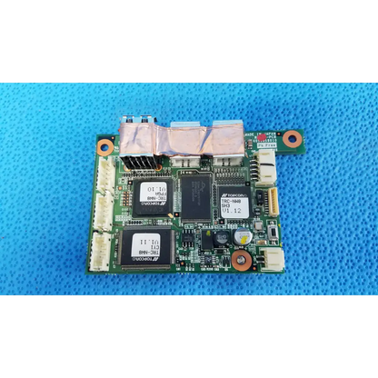 Green logic motherboard board with black integrated circuits and copper heat sinks for topcon fundus retinal camera