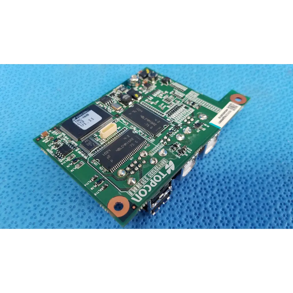 Green topcon logic motherboard board with black integrated circuits and silver connectors for fundus retinal camera use